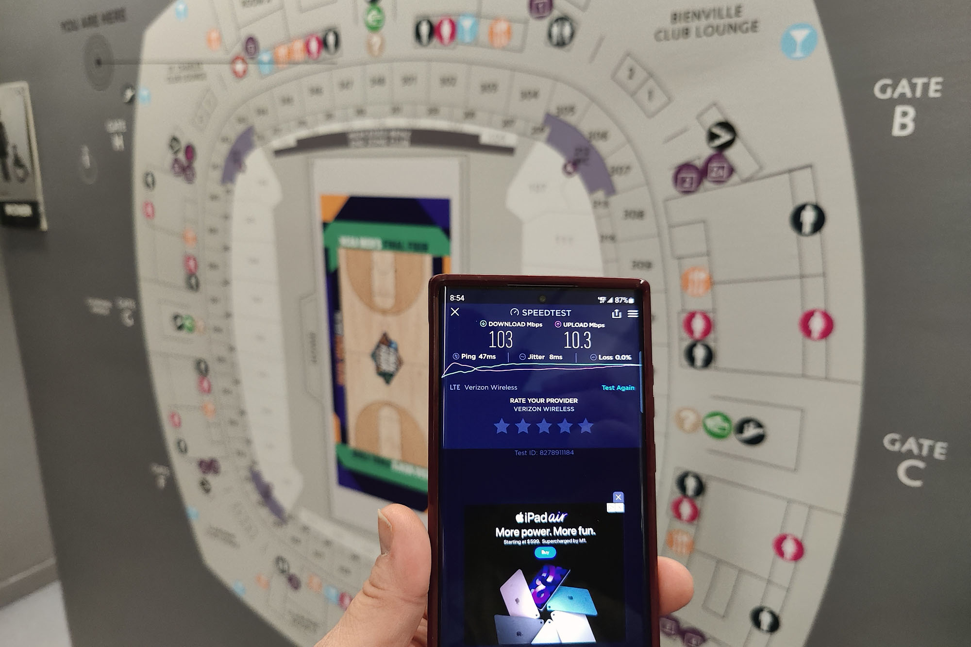 5G test in front of a map of the Superdome.