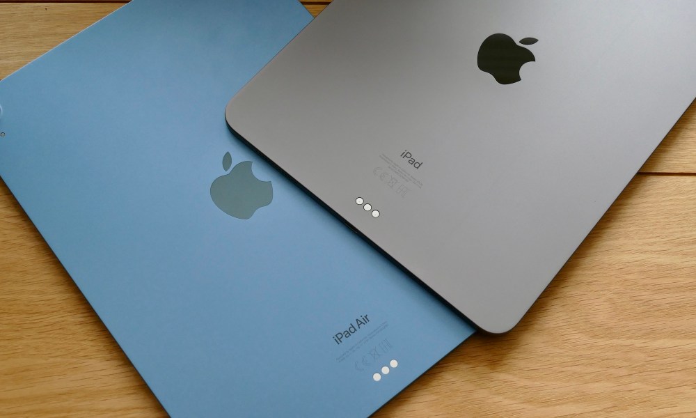 The backs of Apple's iPad Air and iPad Pro, with the tablets place on a table.