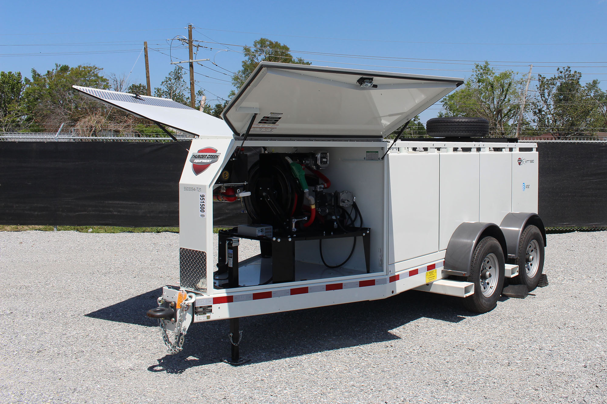 Fuel pump trailer in a parking lot.