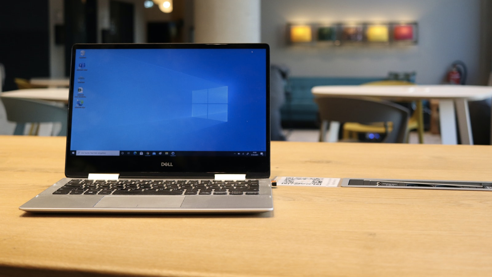 A Dell laptop with Windows 10 sitting on a desk.