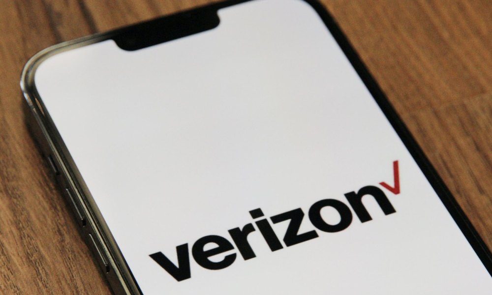 Verizon banner splashed across iPhone screen.