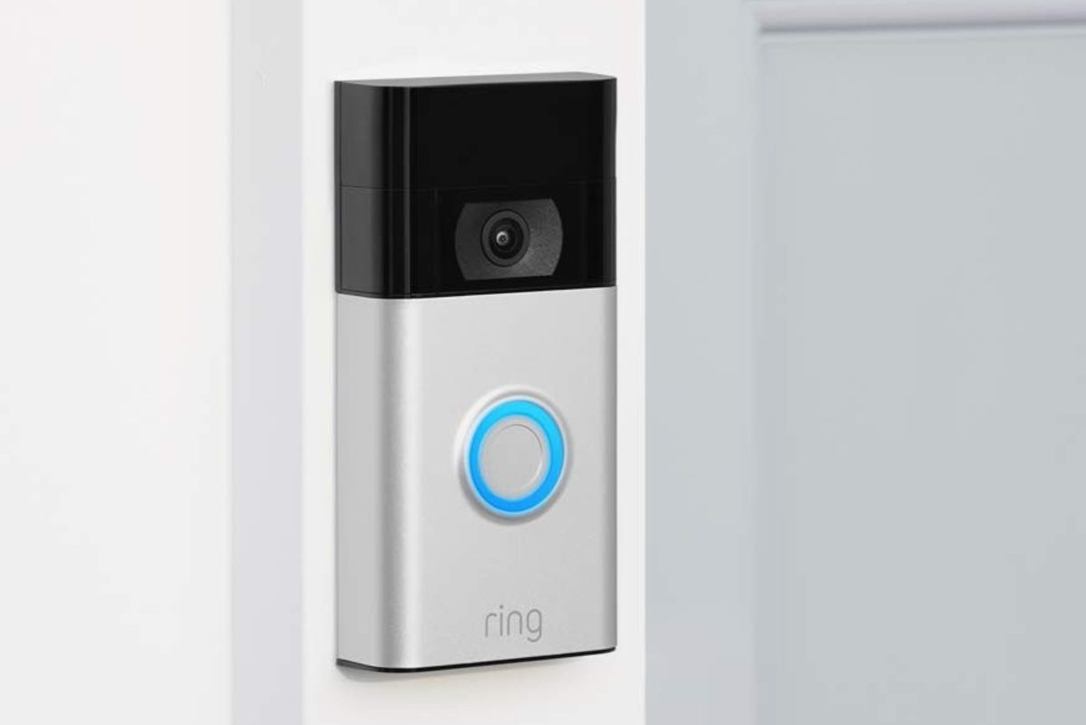 Ring Video Doorbell installed next to a white entry door.