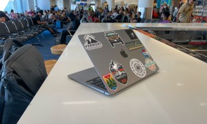 MacBook Air sitting on a table in an airport.