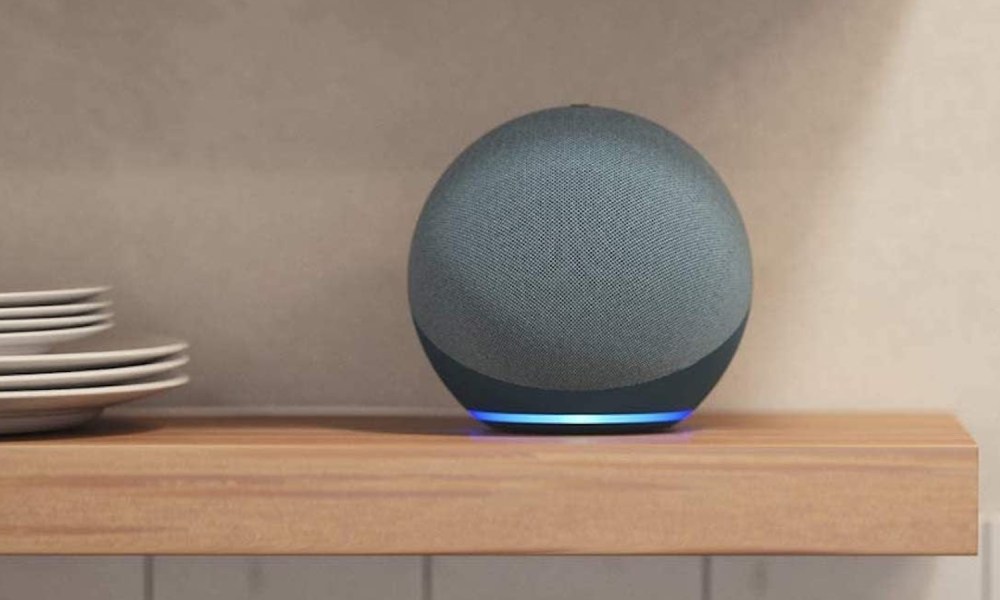 Echo Dot (4th Gen) sits on a shelf in a kitchen.