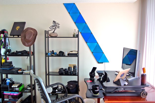 Nanoleaf Shapes light tiles installed next to a desk.