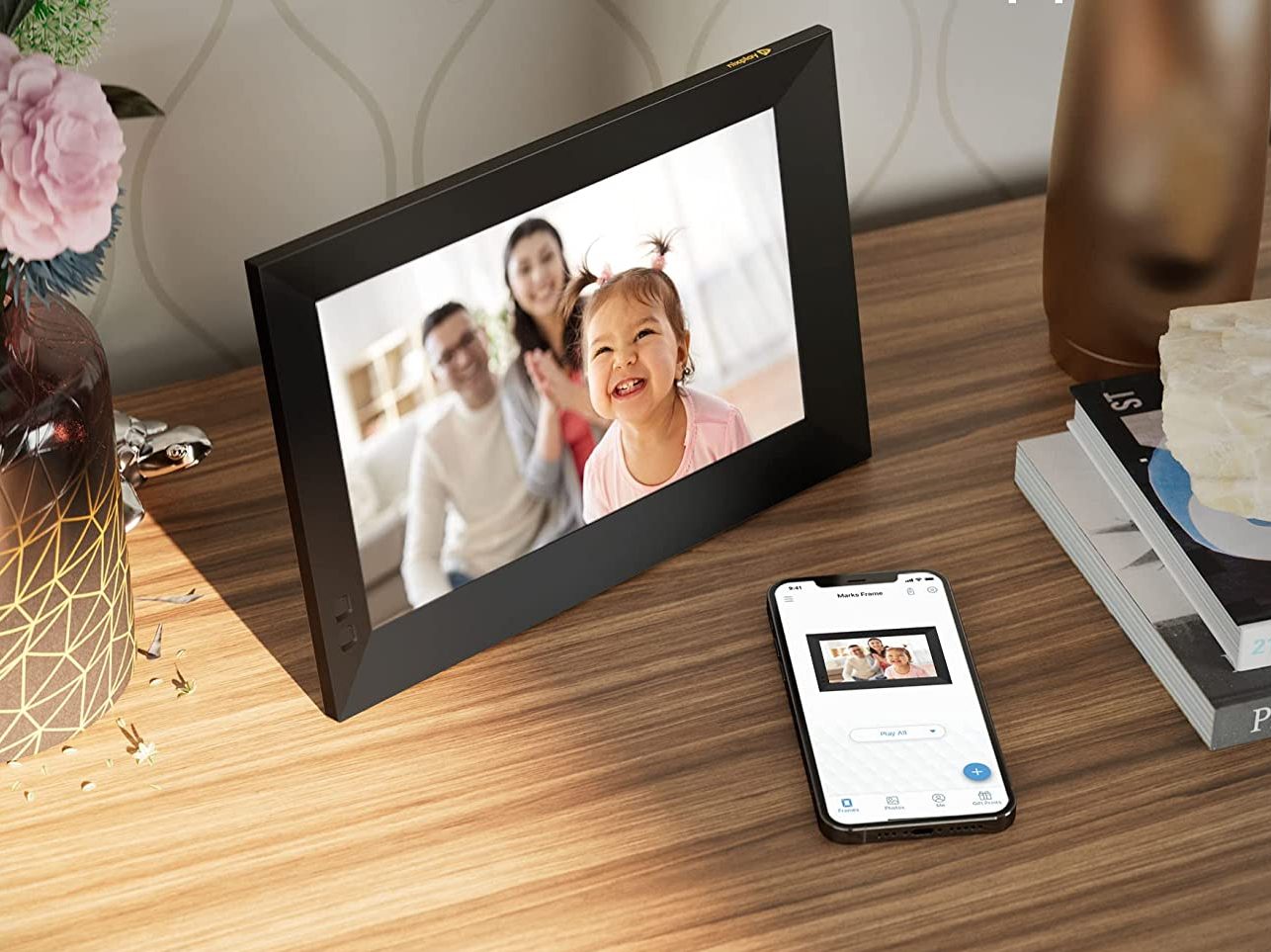 Digital photo frame on a console table.