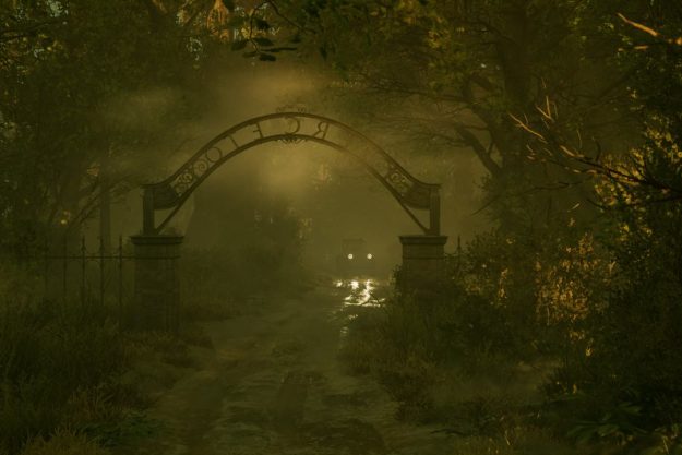 A car driving up to a foggy gate.