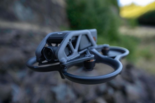 The DJI Avata flying over a boulder field.