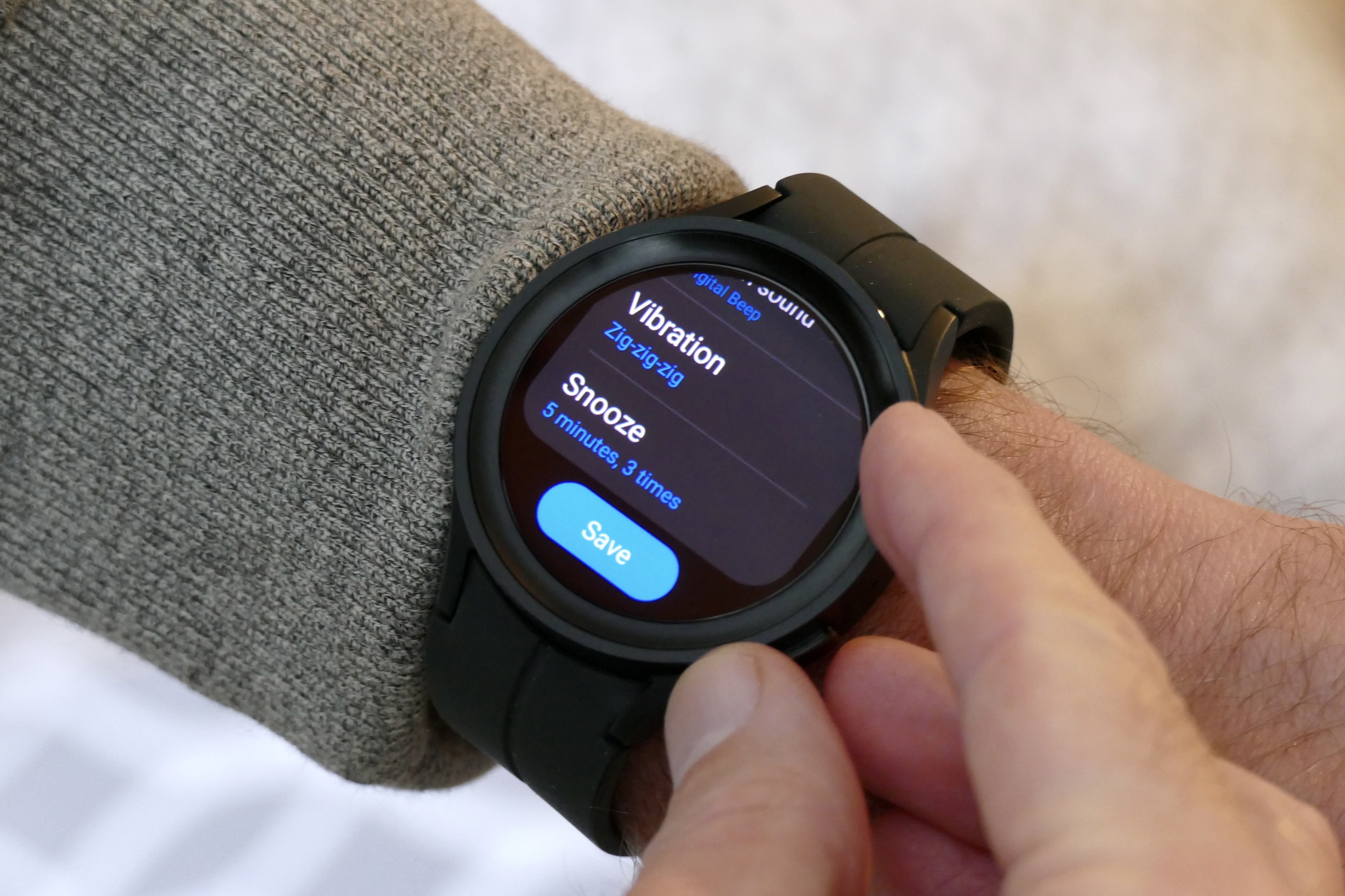 Setting an alarm on the Galaxy Watch 5 Pro.