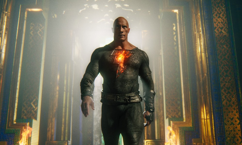 Dwayne Johnson strides toward the camera as Black Adam.