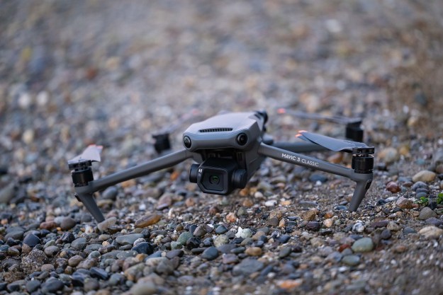 The DJI Mavic 3 Classic on a rocky beach.