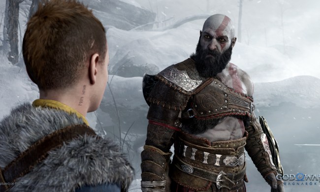 Kratos sternly looks at Atreus in God of War: Ragnarok.