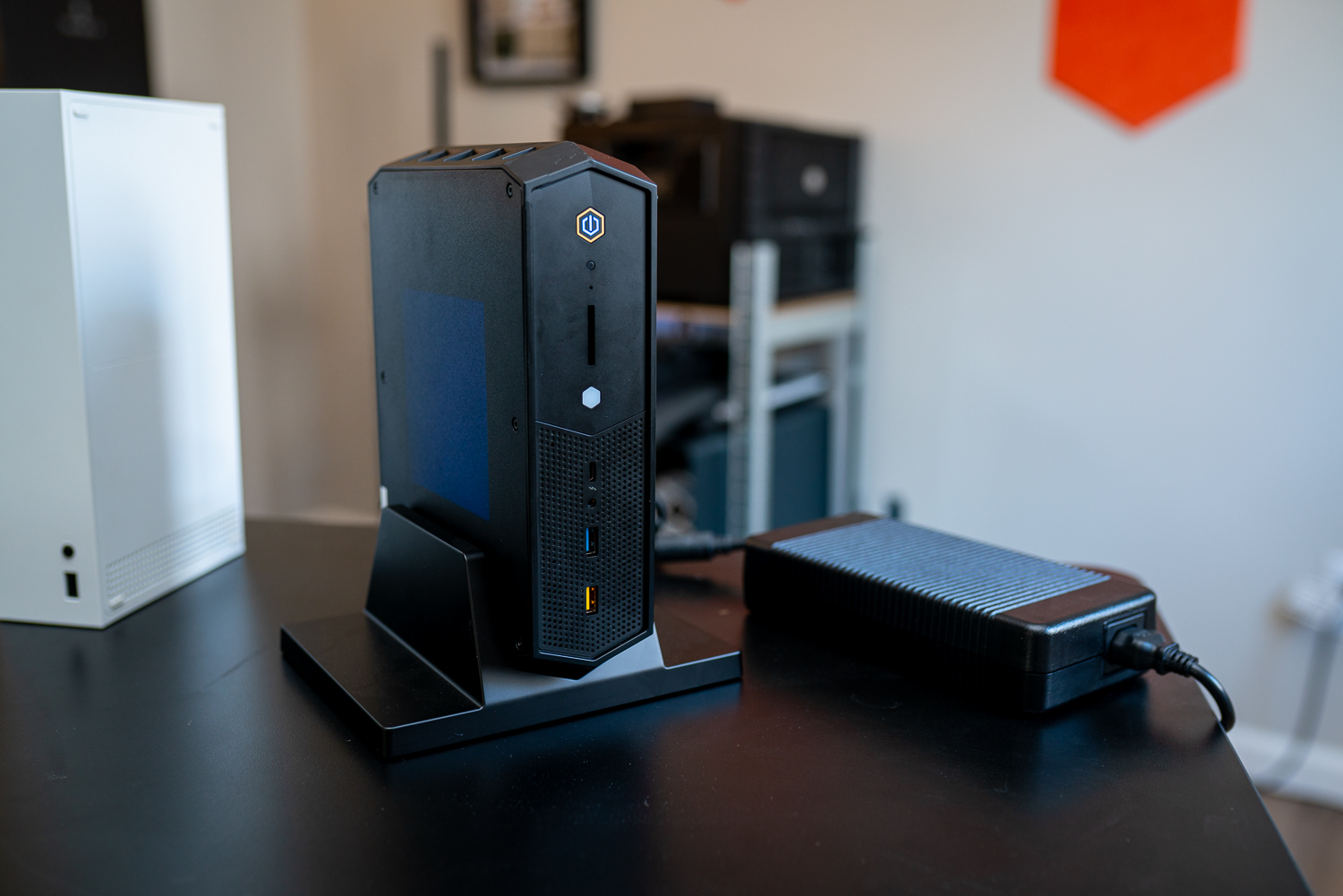 Intel NUC 12 Enthusiast sitting on a desk.