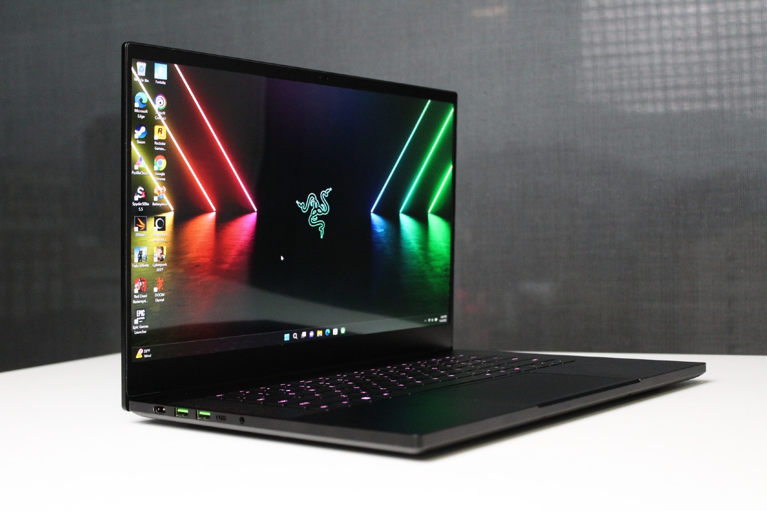 The Razer Blade 15 OLED on a white table.