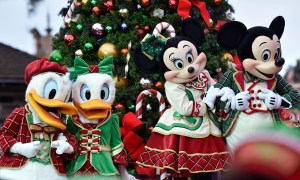 Mickey and Minnie smile on a float in Disney's Magical Parade.