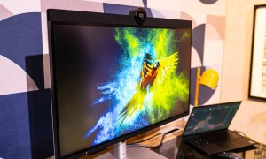 The Dell UltraSharp 6K monitor connected to a laptop on a desk.