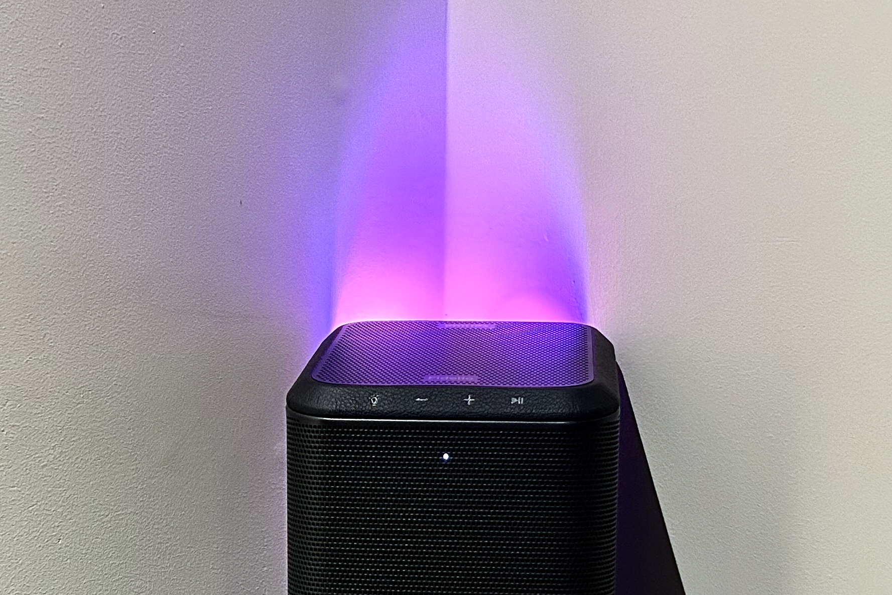 Philips Fidelio FS1 wireless speaker with glowing LED lights.
