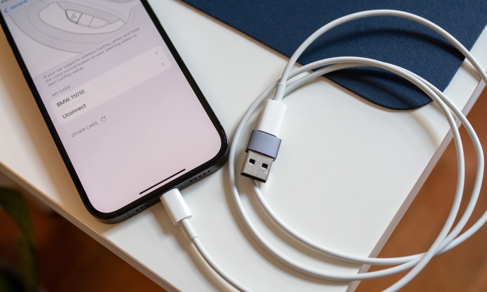 iPhone with USB-C cable and USB-A adapter.