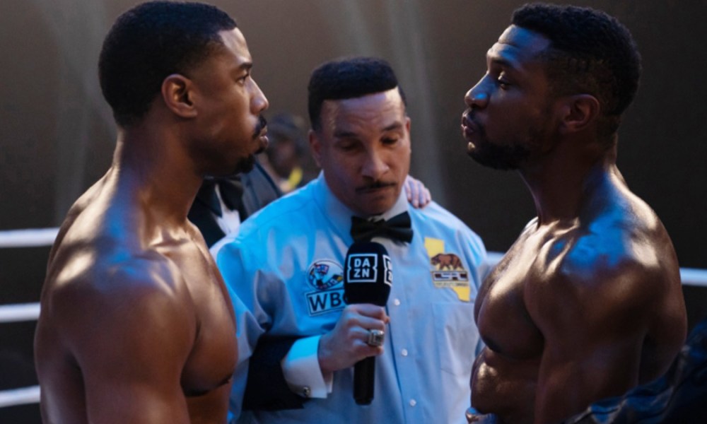 Michael B. Jordan and Jonathan Majors face each other in a boxing ring in Creed 3.