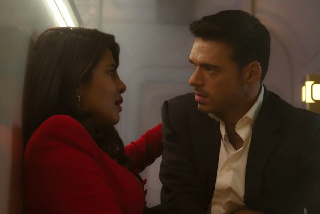 Richard Madden and Priyanka Chopra Jonas look at each other on a train in Citadel.