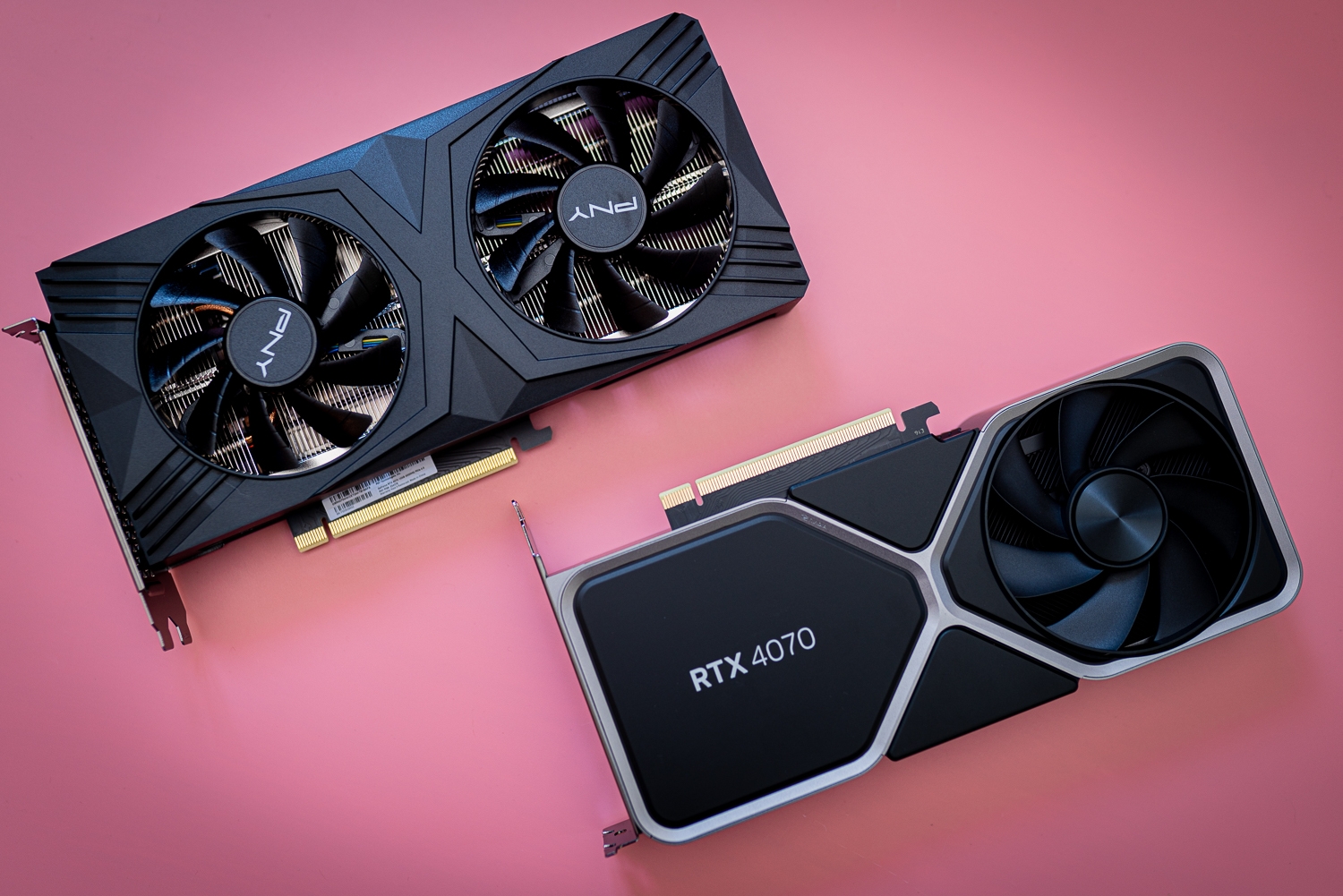 Two RTX 4070 graphics cards sitting side by side.