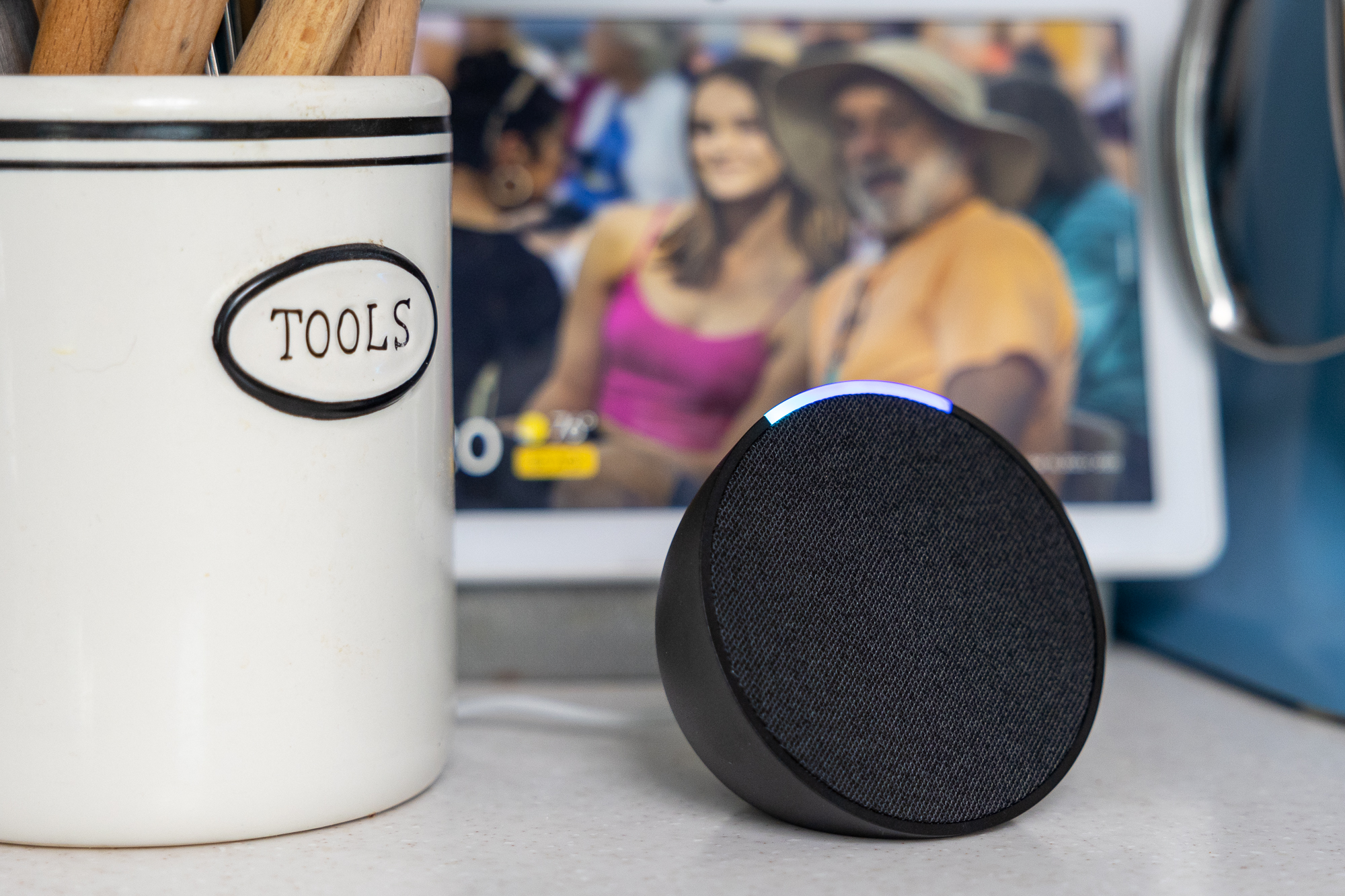 Amazon Echo Pop on a kitchen counter.