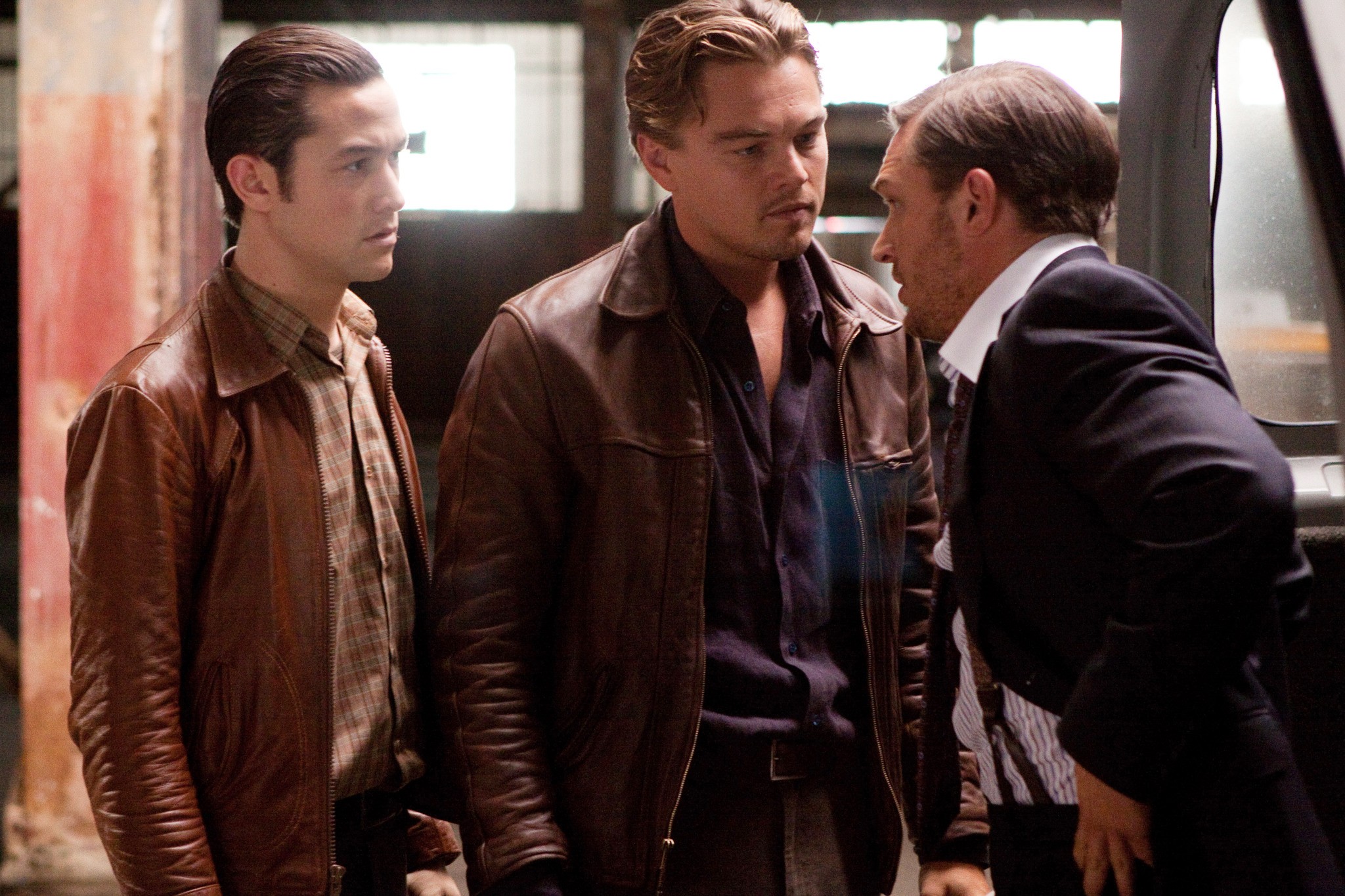 Three men have a talk in Inception.