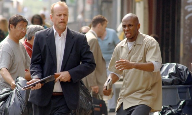 Bruce Willis holds a gun next to Mos Def in 16 Blocks.