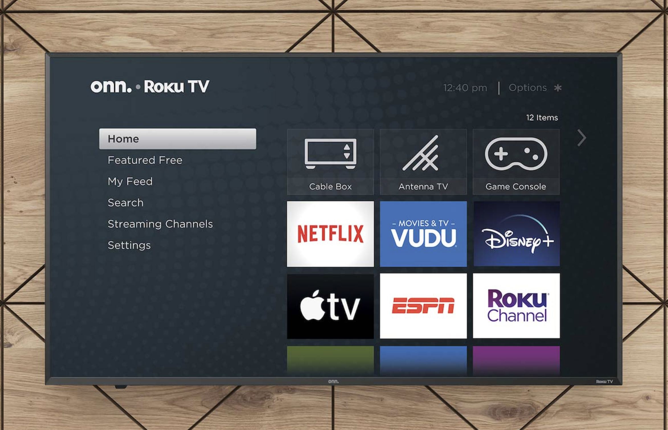 The onn. 50-inch 4K Roku TV hangs on a wall.