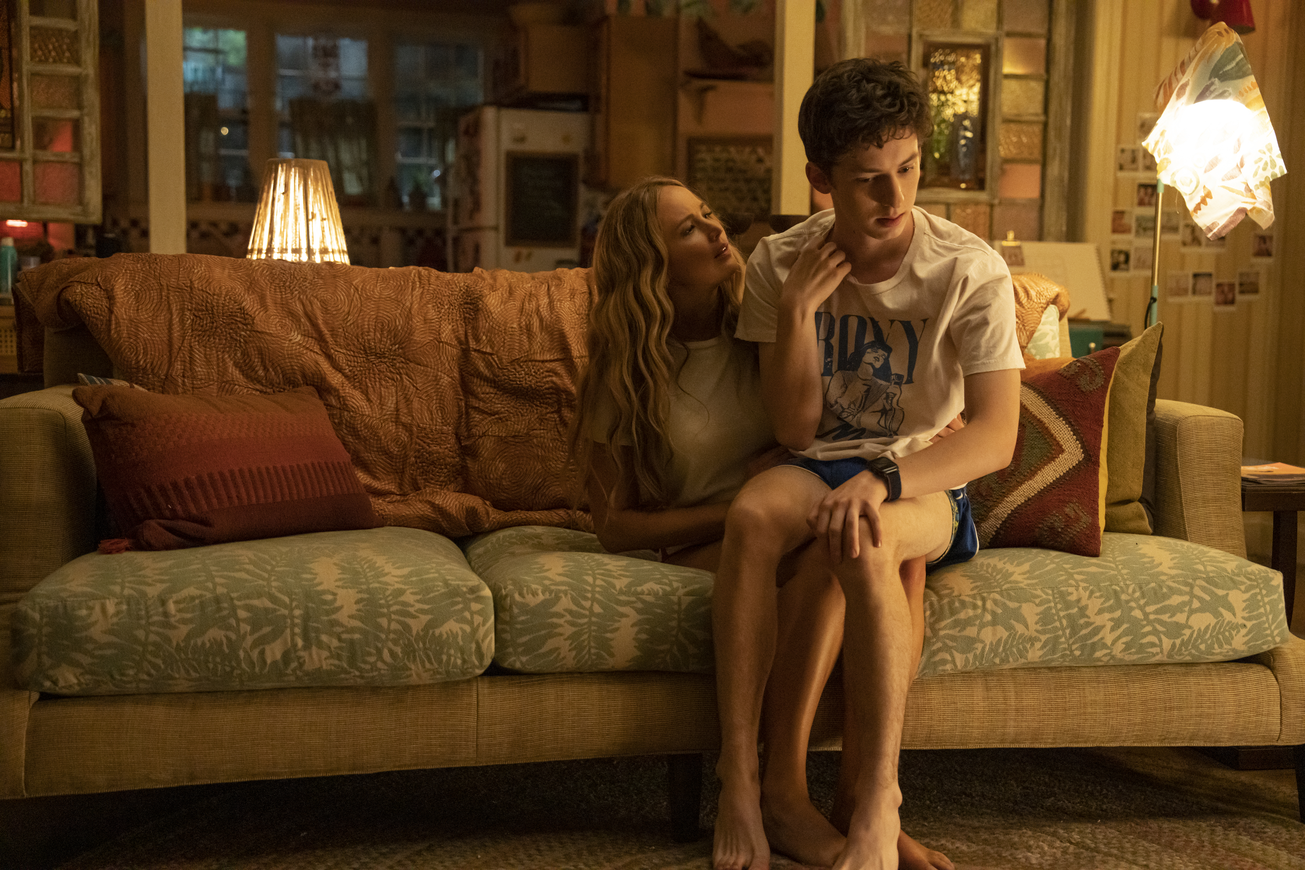 Andrew Barth Feldman sits on Jennifer Lawrence's lap in No Hard Feelings.