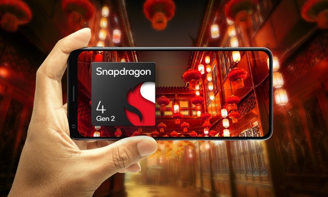 Hand holding phone in landscape orientation focusing on an illustrated scene of Chinese lanterns with Qualcomm Snapdragon 4 Gen 2 logo.