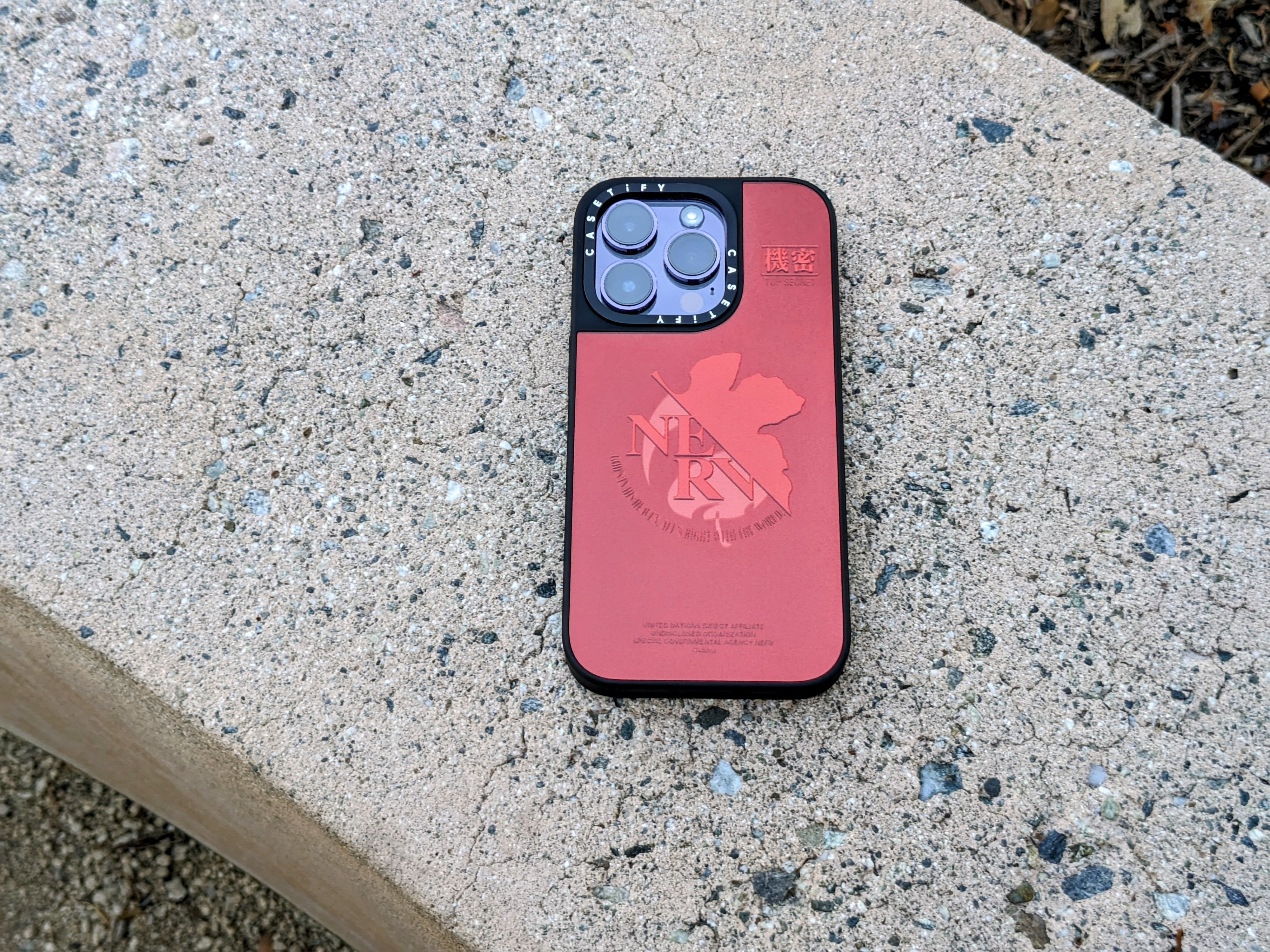 CASETiFY Evangelion NERV Mirror iPhone 14 Pro case.