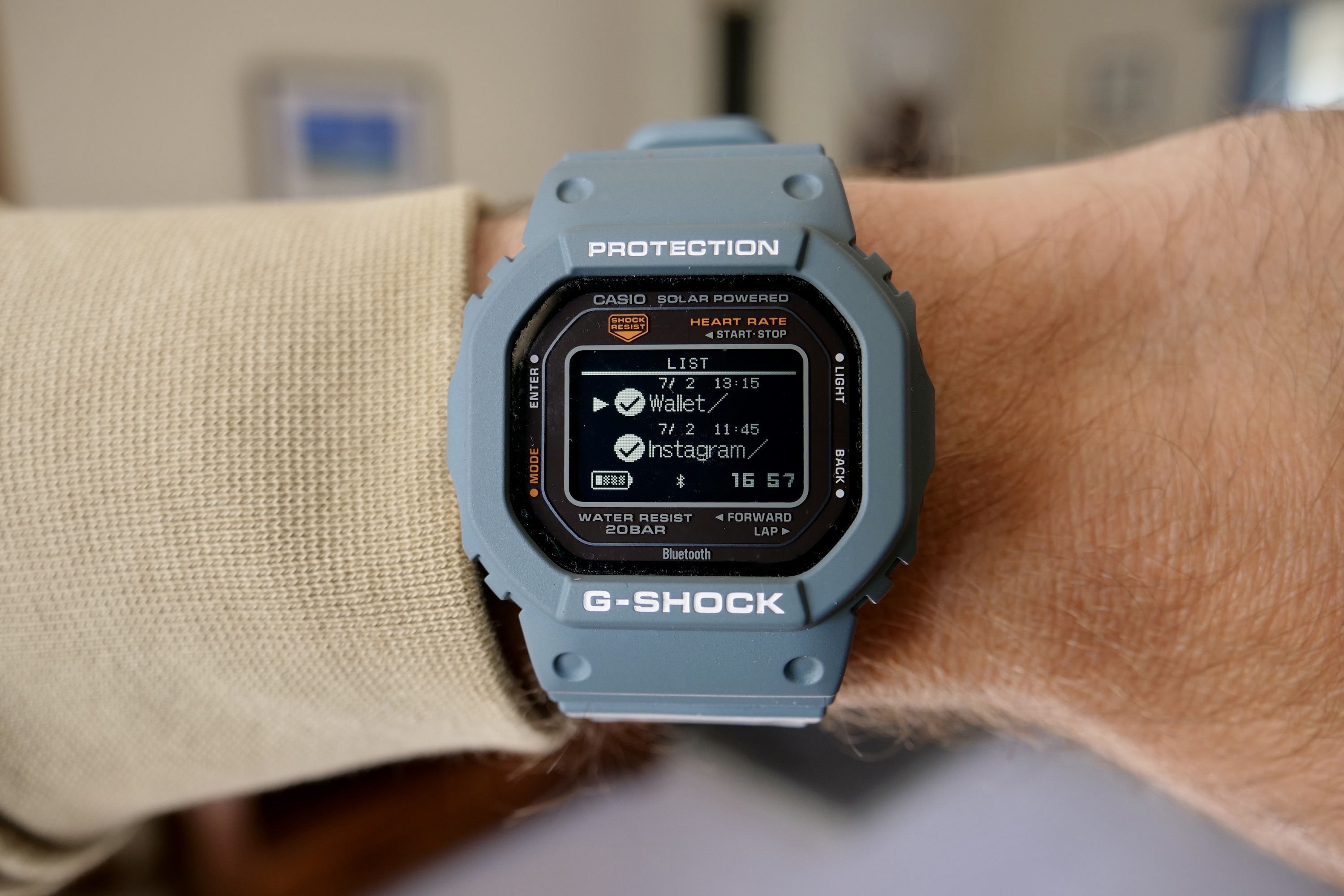 A person wearing the Casio G-Shock DW-H5600, showing notifications.