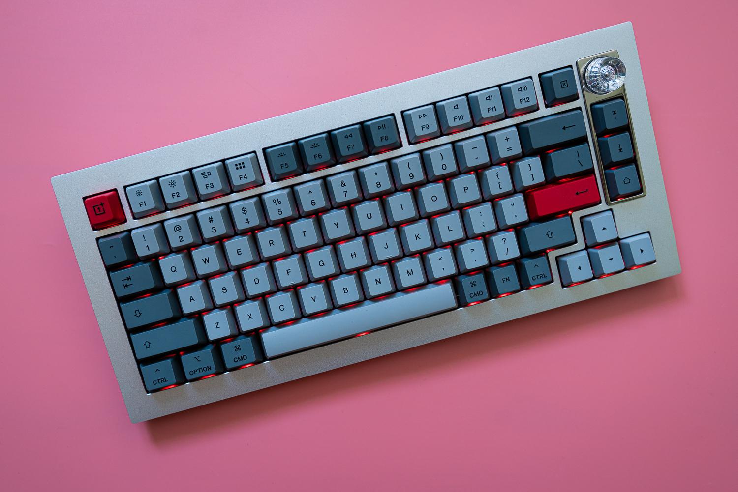 OnePlus Keyboard 81 on a pink background.