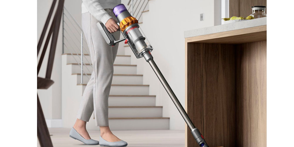 The Dyson V15 being used in someone's house.