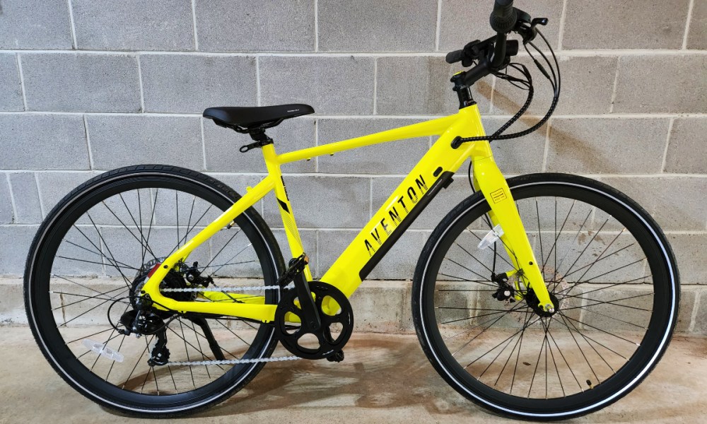 The Aventon Soltera.2 right profile against a concrete brick wall.