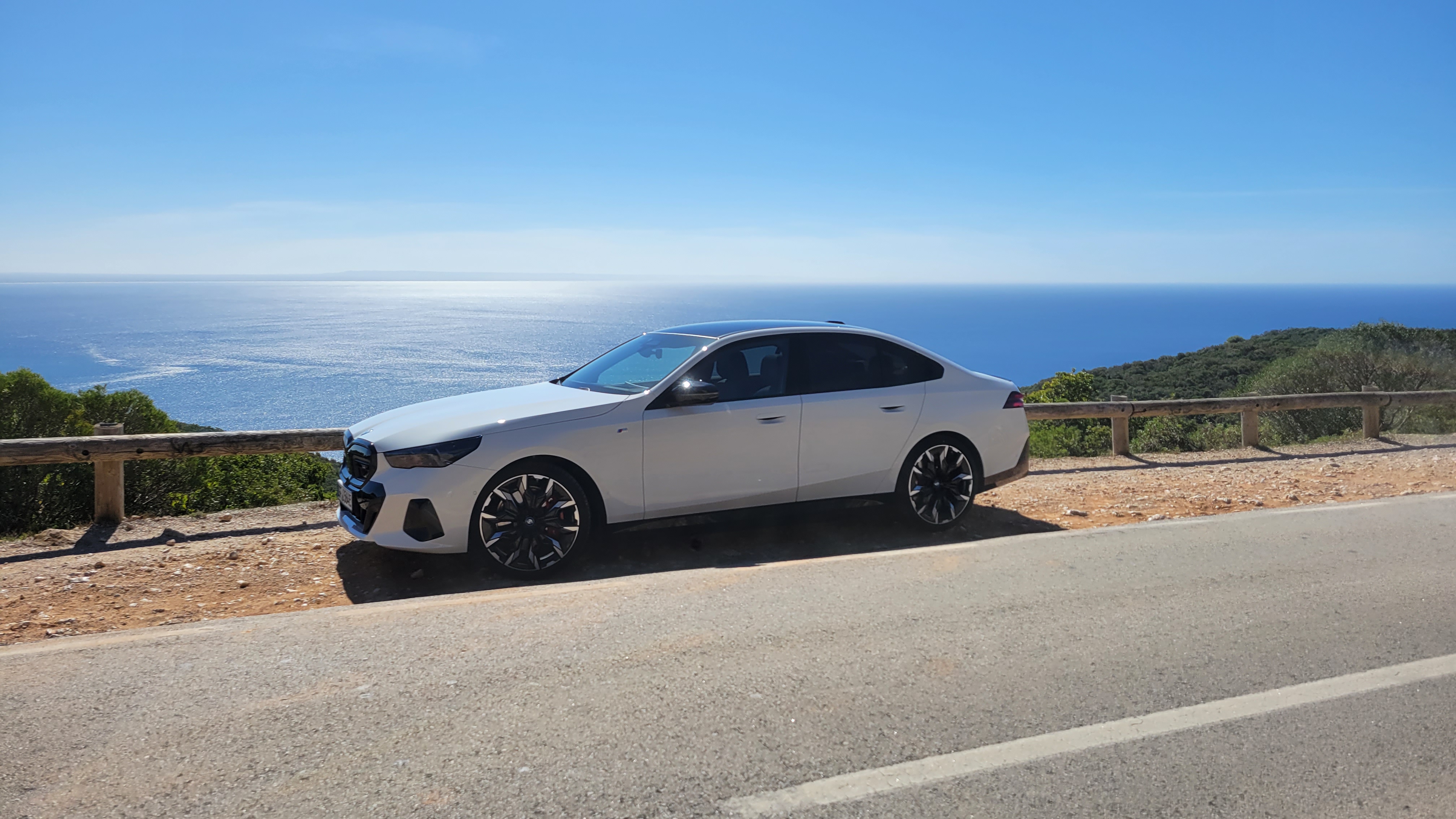 BMW i5 M60 xDrive parked on an overlook