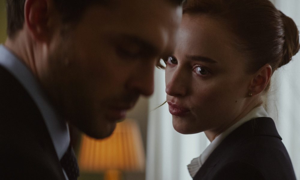 Phoebe Dynevor looks at Alden Ehrenreich in Fair Play.