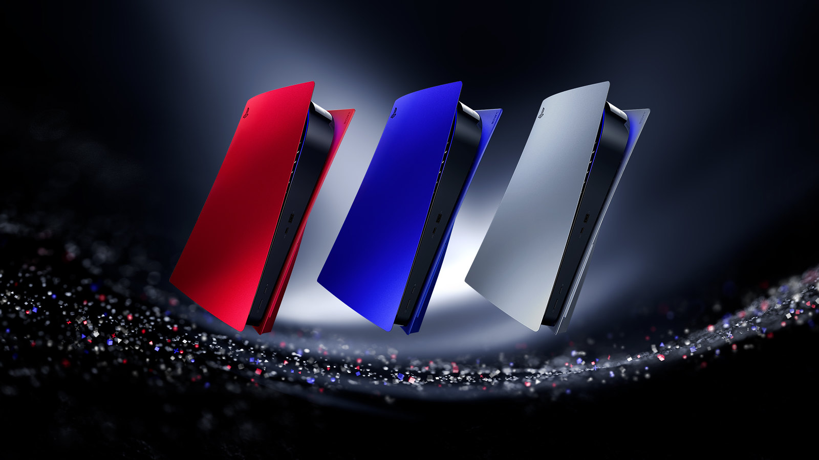 Three colorful PS5s float together in a line.