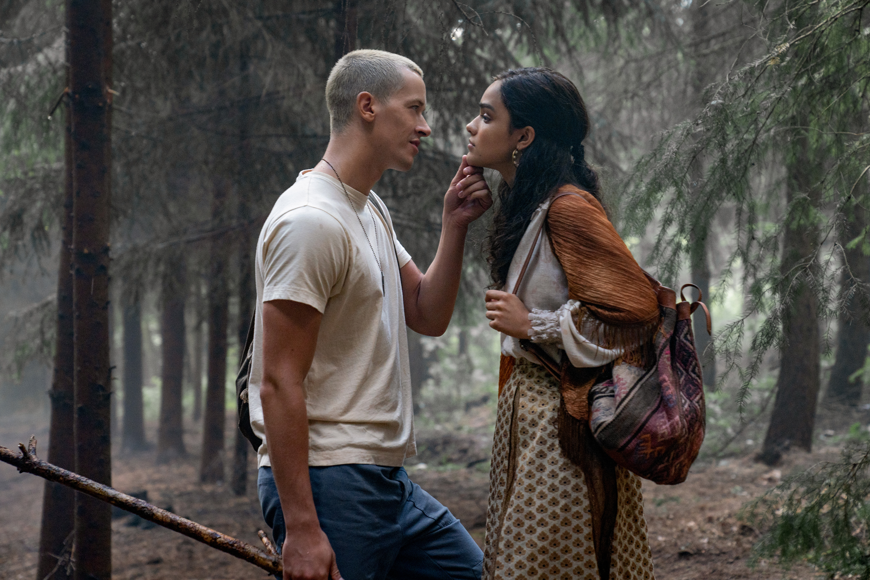 Coriolanus Snow holds Lucy Gray's chin in The Hunger Games: The Ballad of Songbirds & Snakes.