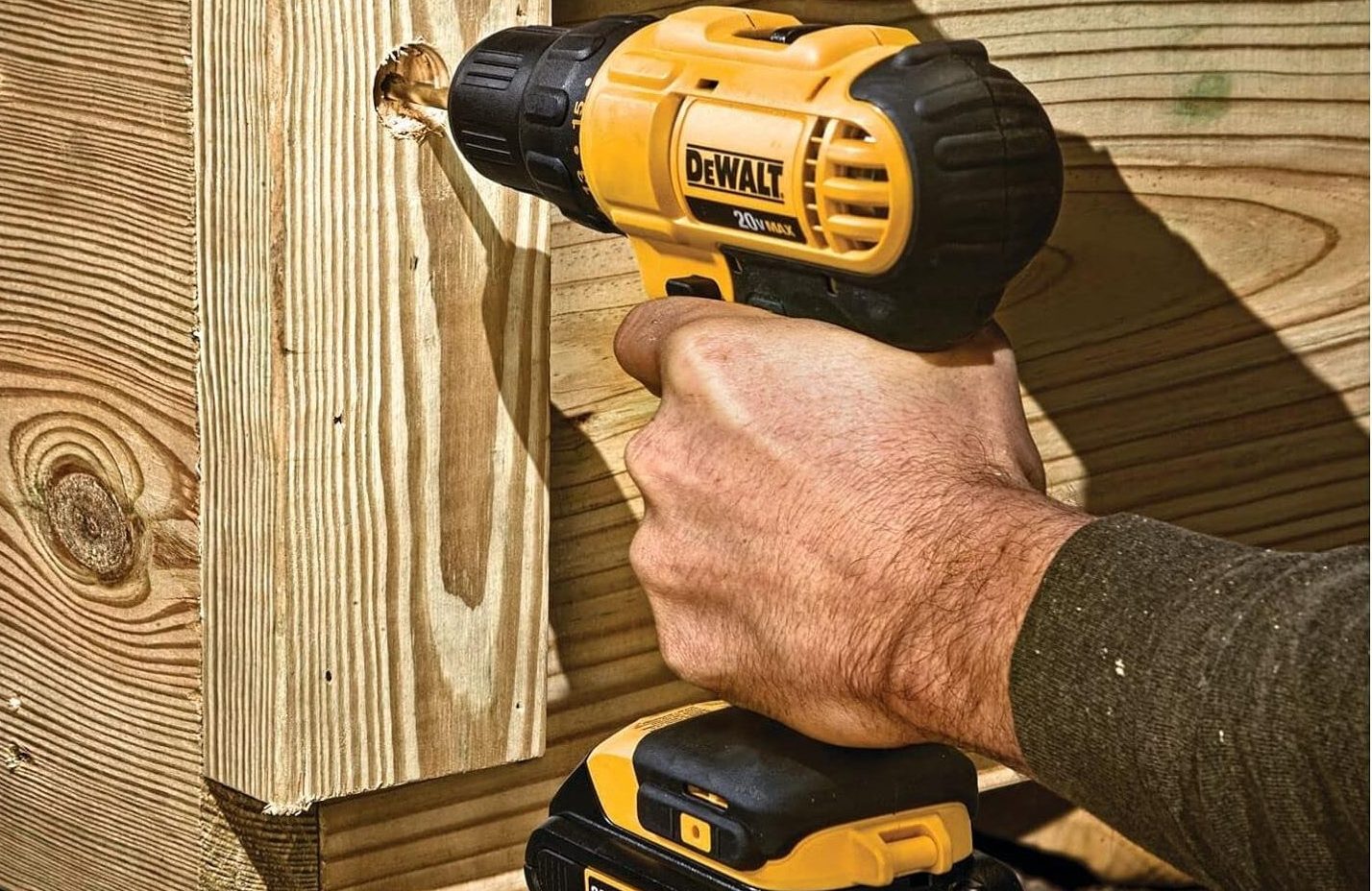 A DeWalt drill being used.