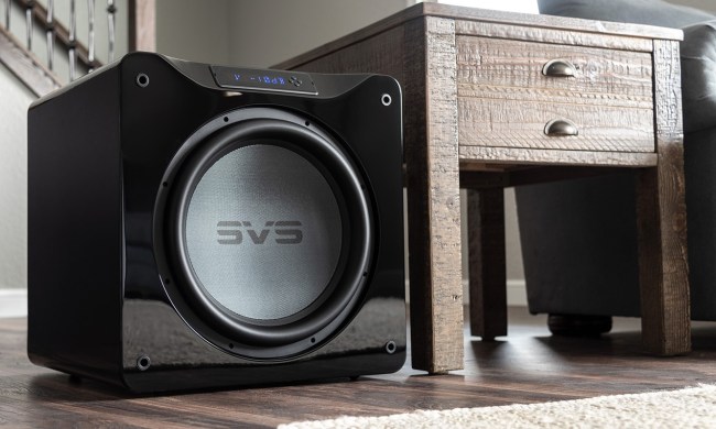 The SVS Sound SB-16 Ultra subwoofer placed next to a TV stand.