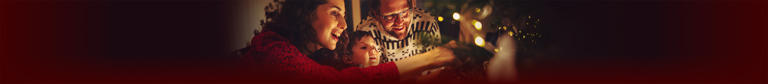 A family decorating a tree.