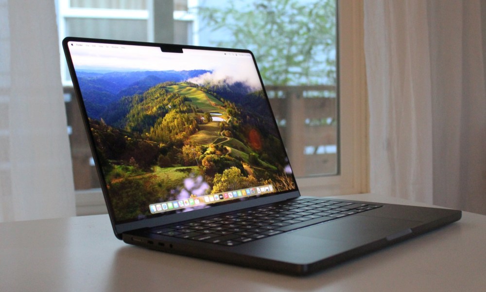 An open MacBook Pro on a table.