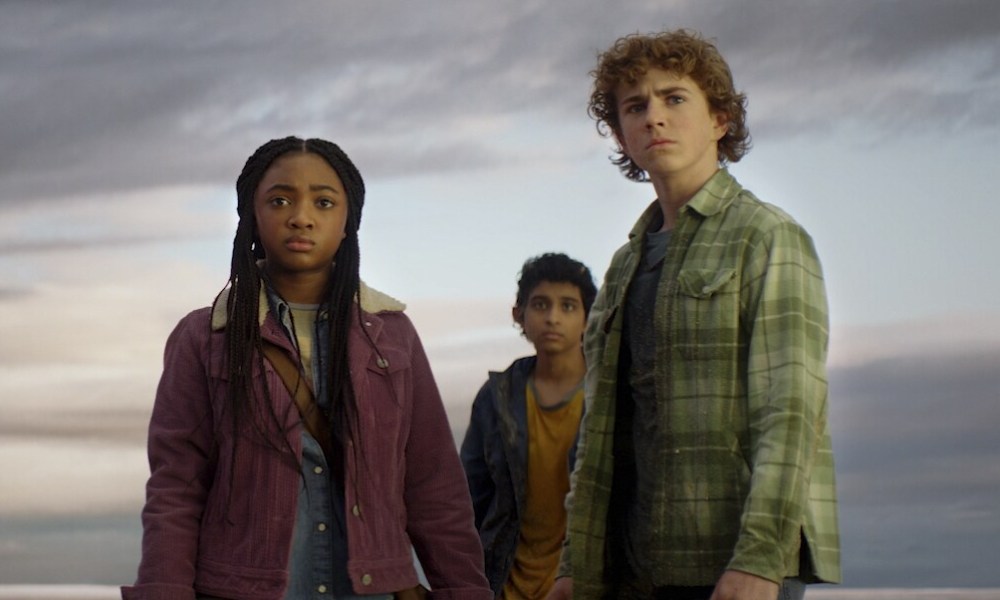 Annabeth, Grover, and Percy stand together in Percy Jackson and the Olympians.