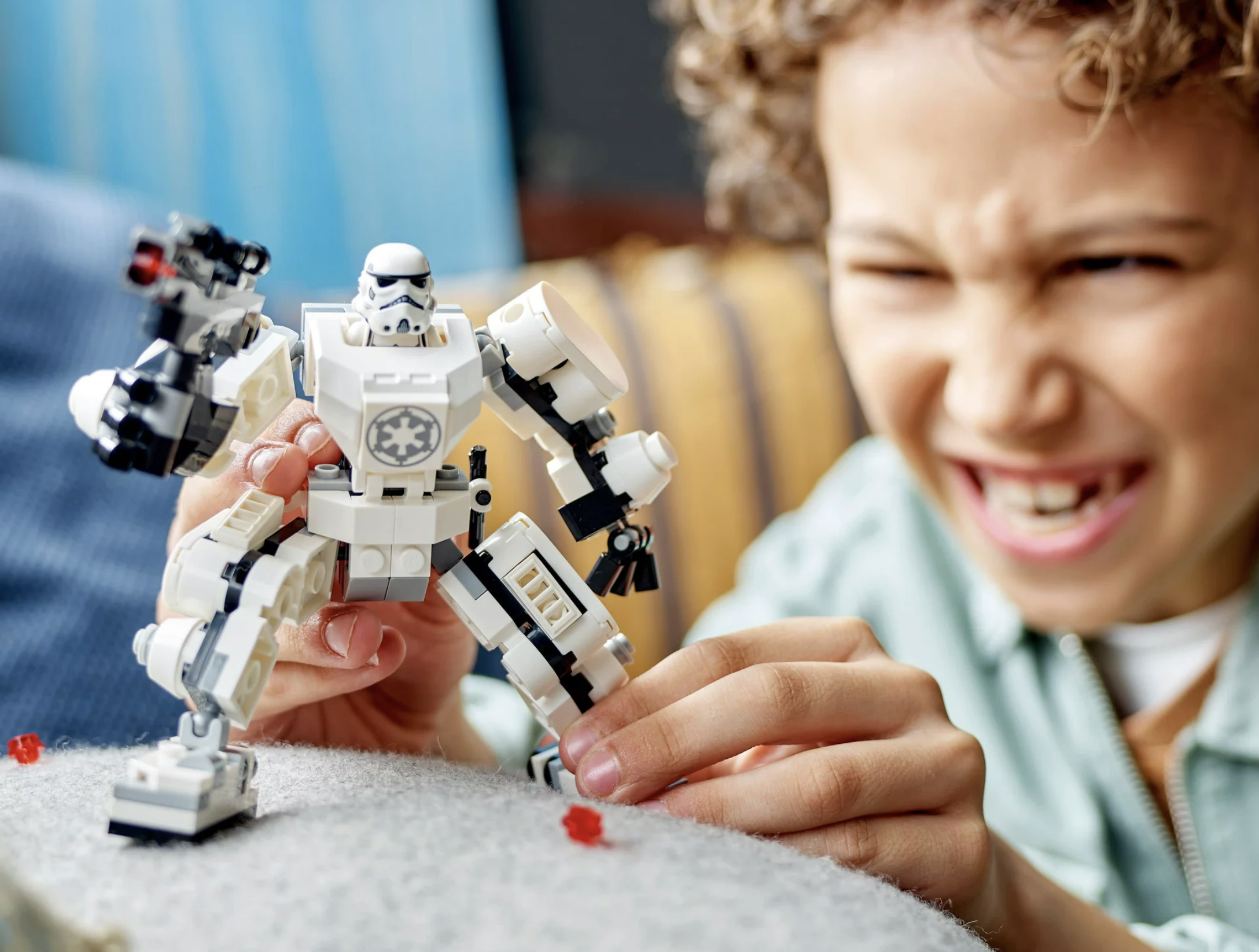 A child playing with the Stormtrooper Lego Set.