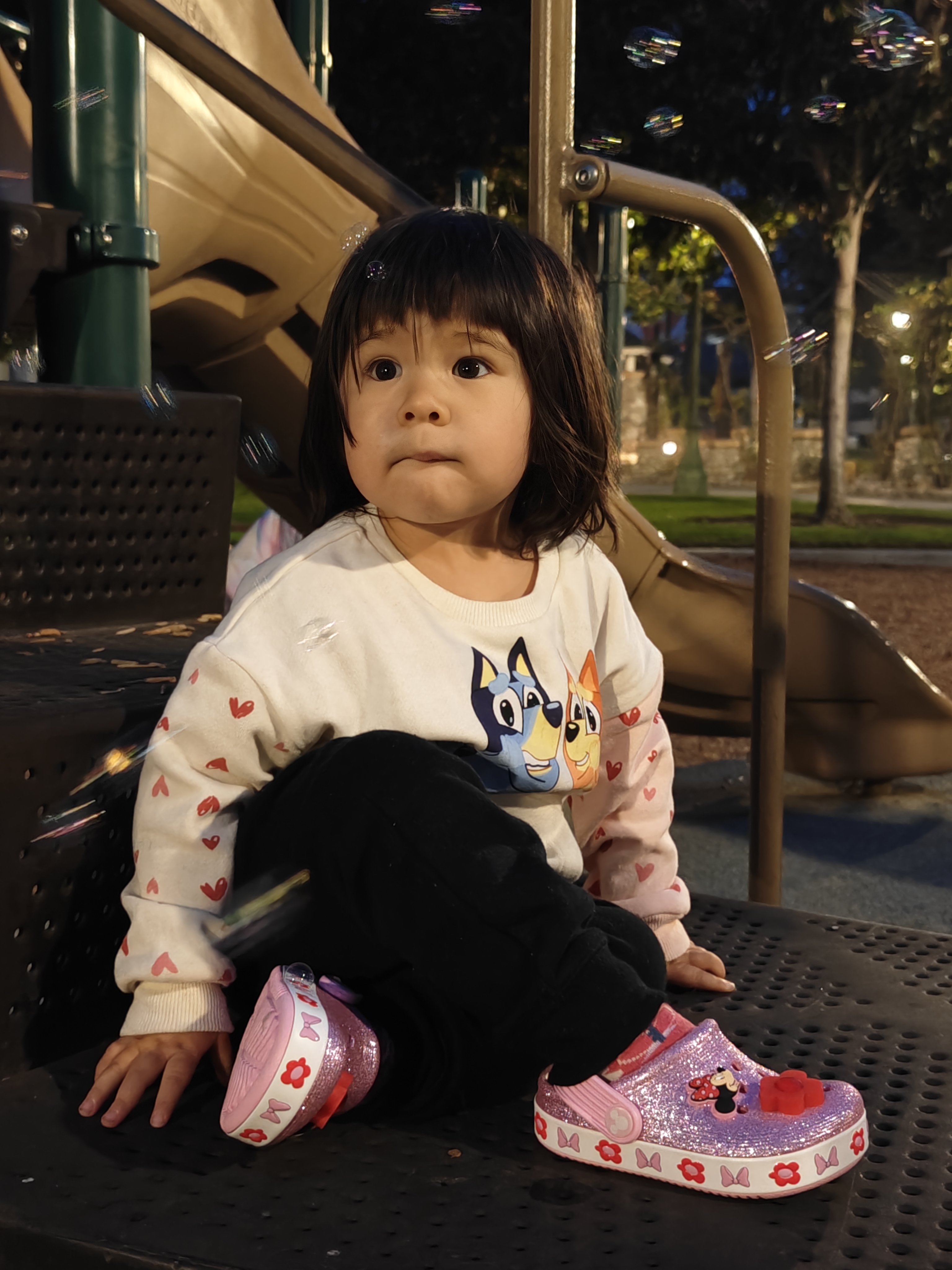 Girl at park playing in evening taken with OnePlus 12.