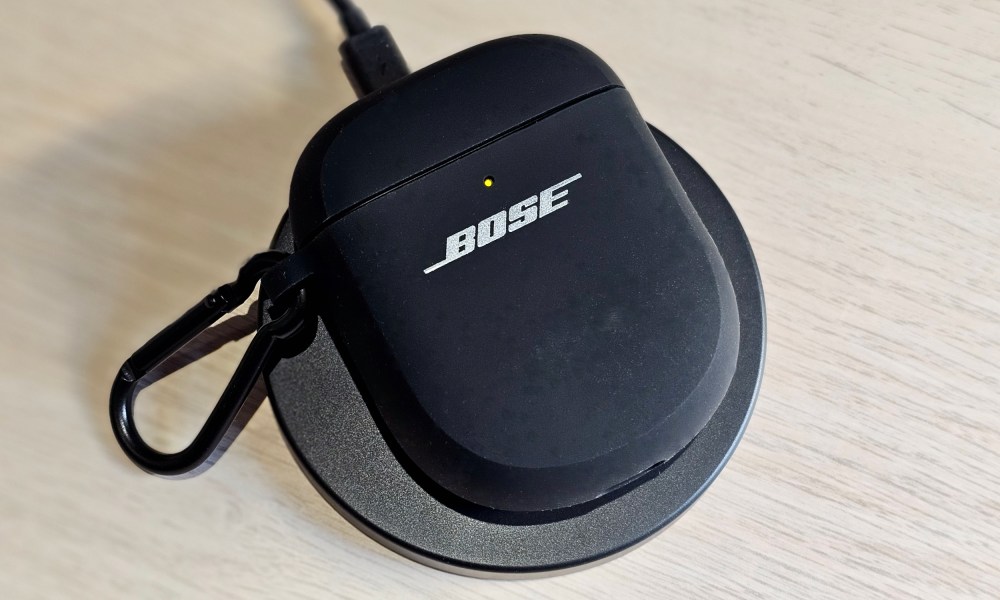 Bose Wireless Charging Case Cover in use on a wireless charging mat.