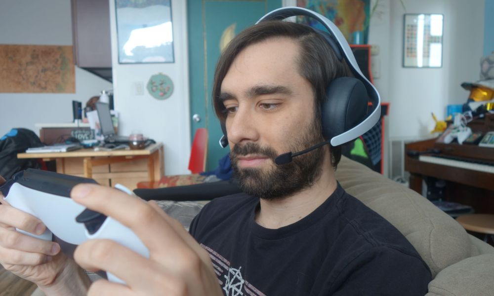 A man wears a Pulse Elite headset.