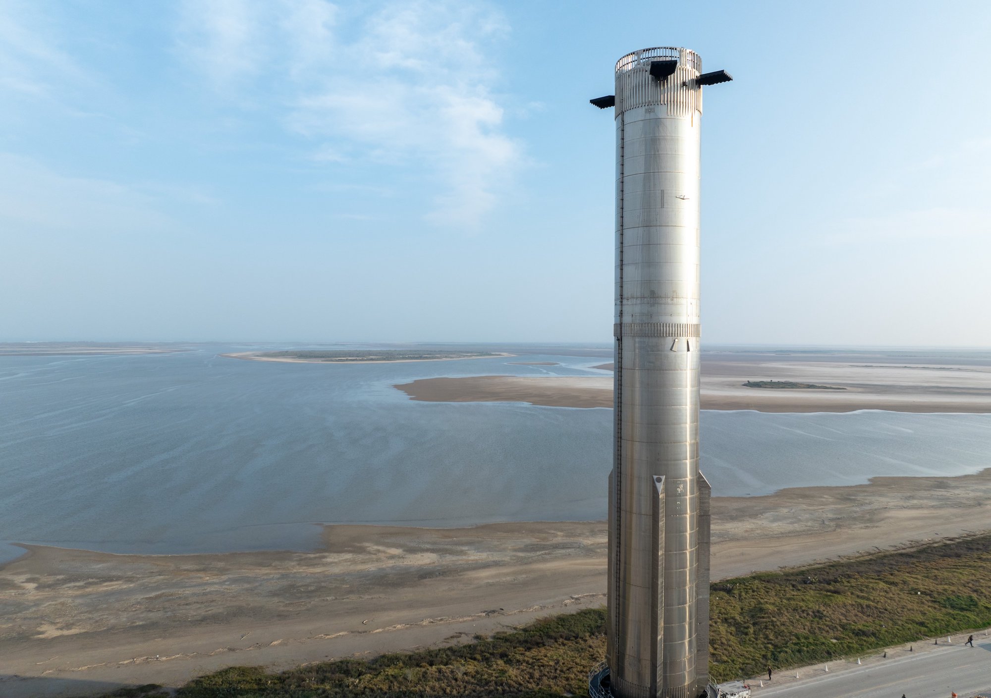 SpaceX's first-stage Super Heavy booster on its way to the launchpad at its Starbase site in Boca Chica, Texas.